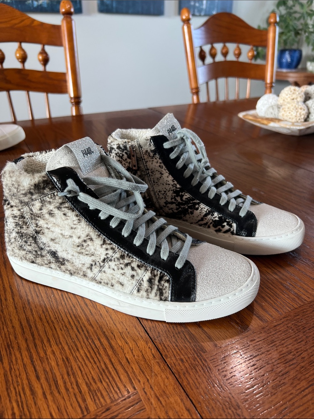 Women’s size 38 (size 7.5-8) P448 Star “cow softy” calf hair high top sneaker.